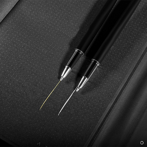 Black notebook and silver pen