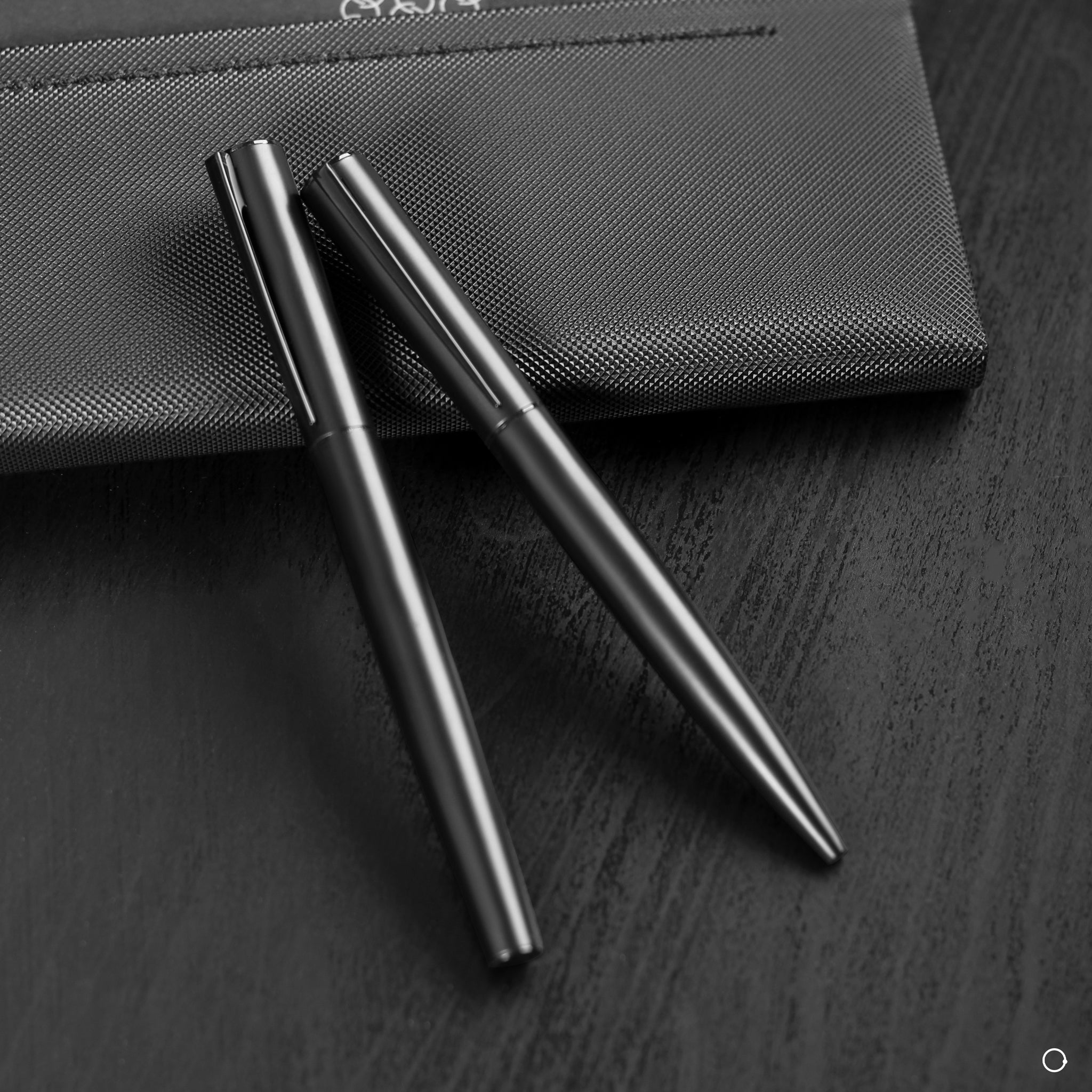 Two Black Metal Pens together
