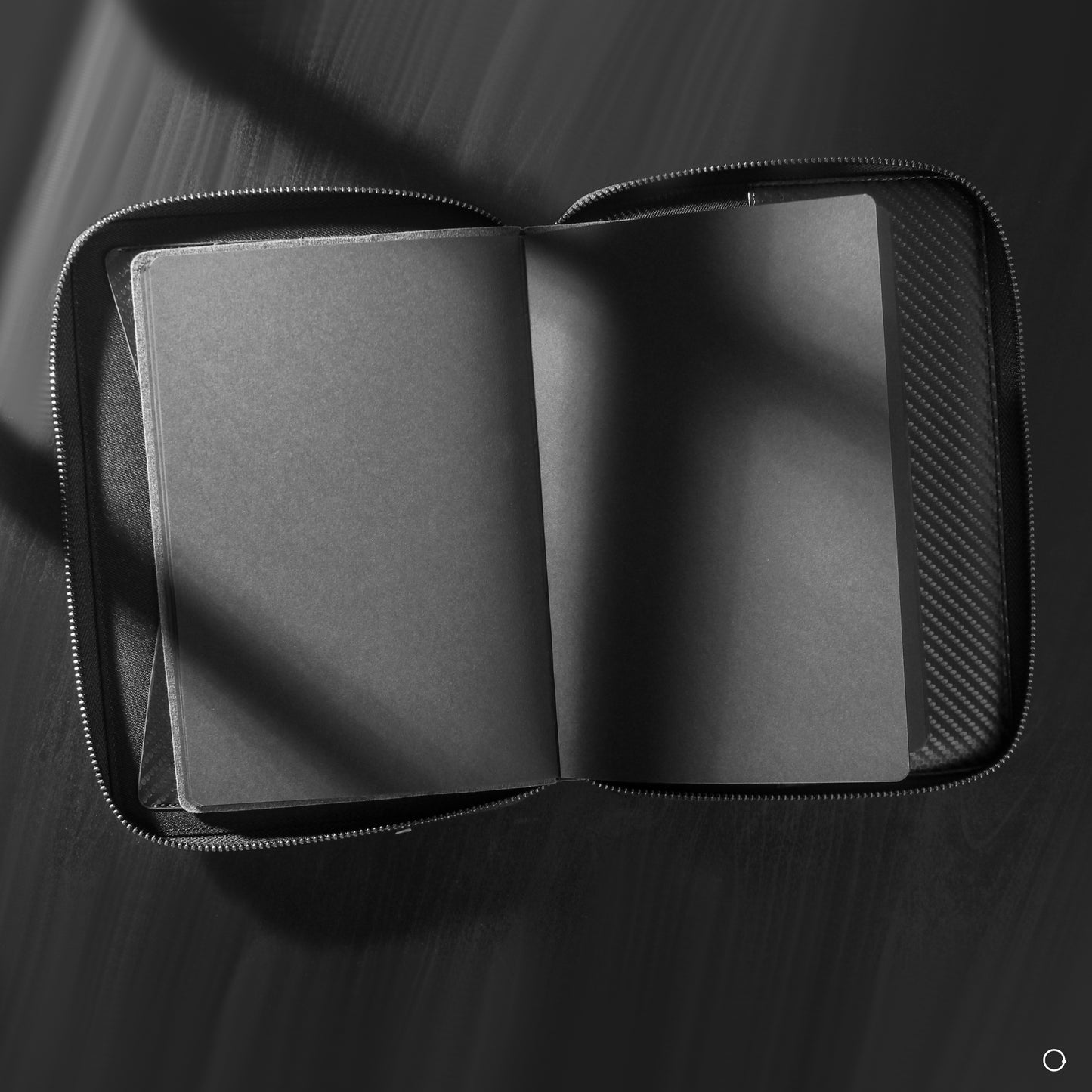 black notebook with black paper 