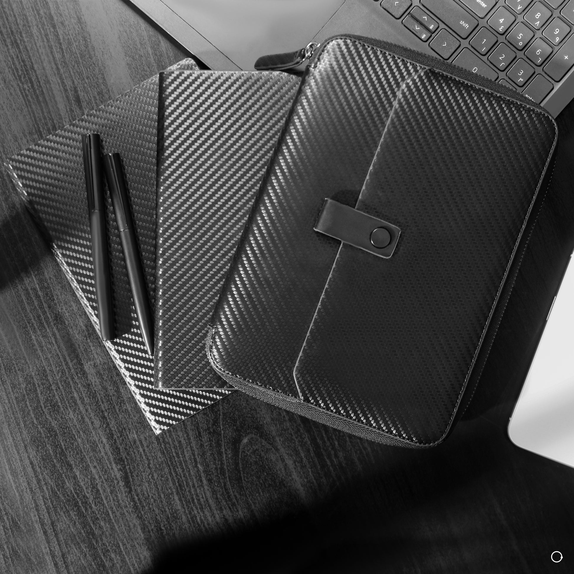 black notebook with silver pen 