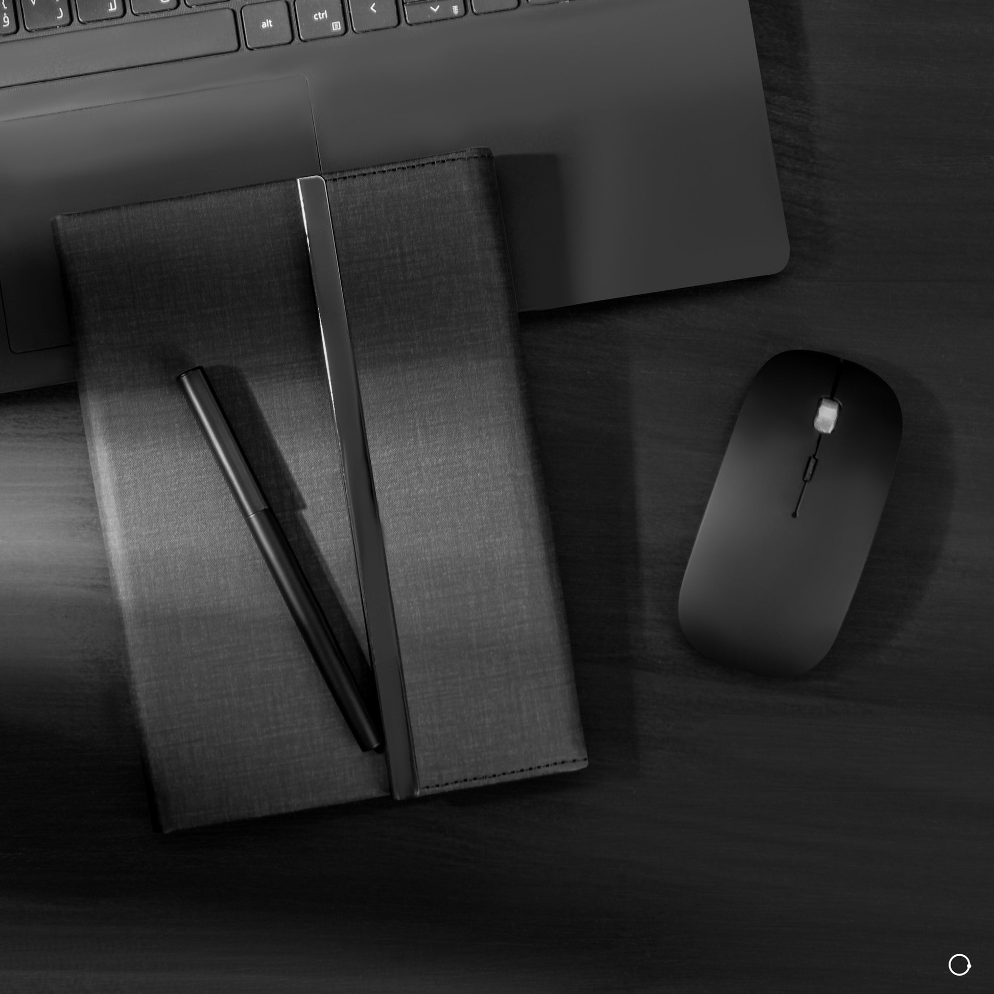 silver pen and black notebook 